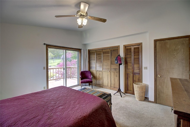 31521 Mcdonald Lake Rd, Saint Ignatius, MT 59865 - carpeted bedroom featuring access to outside, two closets, ceiling fan, and baseboards