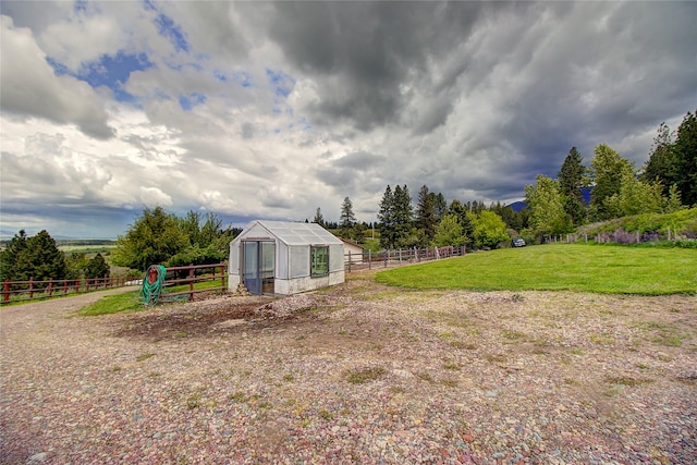 31521 Mcdonald Lake Rd, Saint Ignatius, MT 59865 - view of yard featuring a greenhouse and an outbuilding