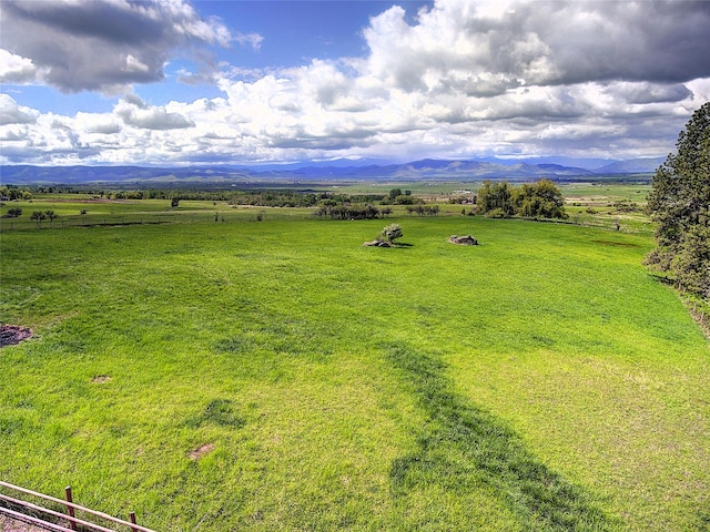 31521 Mcdonald Lake Rd, Saint Ignatius, MT 59865 - overview of rural landscape with a mountain backdrop and a pastoral area