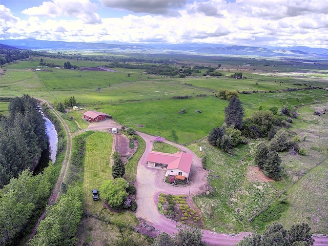 31521 Mcdonald Lake Rd, Saint Ignatius, MT 59865 - aerial view of sparsely populated area with a mountain backdrop