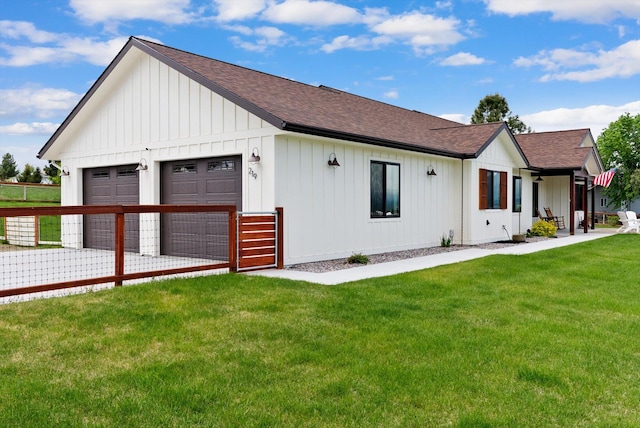 219 Rudys Way, Hamilton, MT 59840 - modern farmhouse style home featuring roof with shingles, board and batten siding, and a front lawn