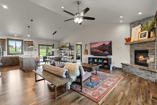 219 Rudys Way, Hamilton, MT 59840 - living area with a fireplace, dark wood-type flooring, ceiling fan, recessed lighting, and high vaulted ceiling