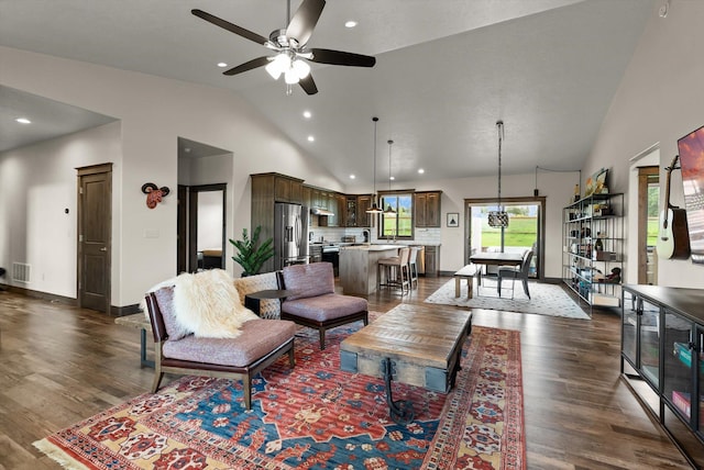 219 Rudys Way, Hamilton, MT 59840 - living room with dark wood-style flooring, ceiling fan, high vaulted ceiling, baseboards, and recessed lighting