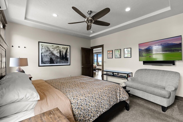 219 Rudys Way, Hamilton, MT 59840 - carpeted bedroom featuring a tray ceiling, recessed lighting, ceiling fan, and a textured ceiling