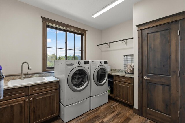 219 Rudys Way, Hamilton, MT 59840 - laundry area with independent washer and dryer, cabinet space, and dark wood finished floors