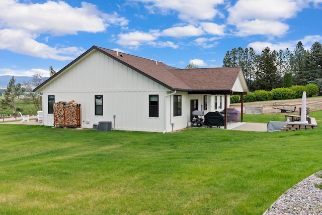 219 Rudys Way, Hamilton, MT 59840 - back of property with a patio, a yard, roof with shingles, and board and batten siding