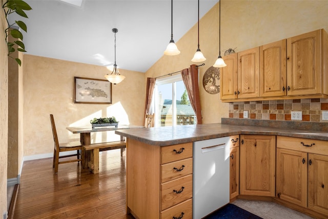 280 Hartt Hill Dr, Kalispell, MT 59901 - kitchen featuring white dishwasher, dark countertops, backsplash, wood finished floors, and high vaulted ceiling