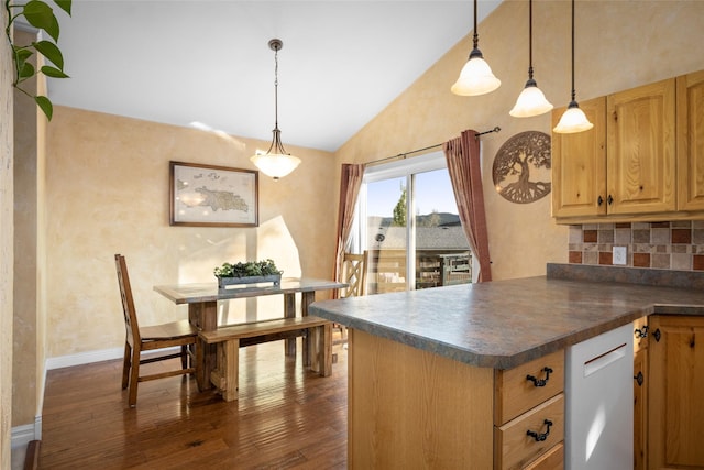 280 Hartt Hill Dr, Kalispell, MT 59901 - kitchen featuring lofted ceiling, dark wood finished floors, dark countertops, tasteful backsplash, and white dishwasher