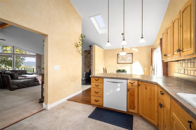 280 Hartt Hill Dr, Kalispell, MT 59901 - kitchen featuring dishwasher, a skylight, high vaulted ceiling, a peninsula, and pendant lighting