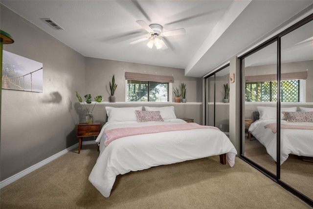 280 Hartt Hill Dr, Kalispell, MT 59901 - carpeted bedroom with multiple closets, ceiling fan, and baseboards