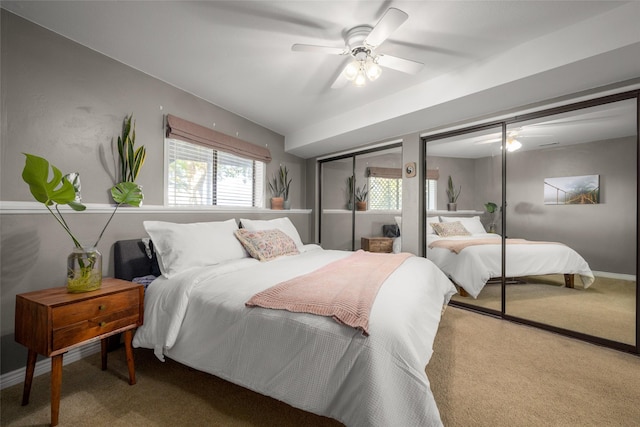280 Hartt Hill Dr, Kalispell, MT 59901 - carpeted bedroom featuring a ceiling fan and two closets