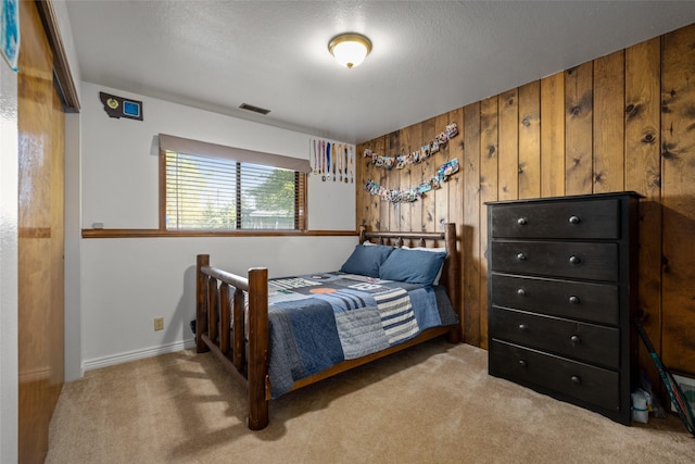 280 Hartt Hill Dr, Kalispell, MT 59901 - carpeted bedroom featuring wood walls and baseboards