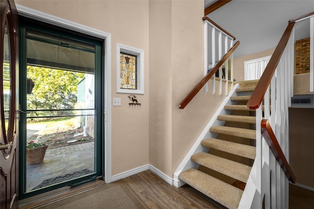 280 Hartt Hill Dr, Kalispell, MT 59901 - foyer featuring wood finished floors, stairway, and baseboards