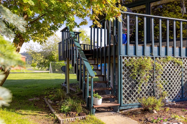 280 Hartt Hill Dr, Kalispell, MT 59901 - view of play area featuring stairs, a lawn, and a deck