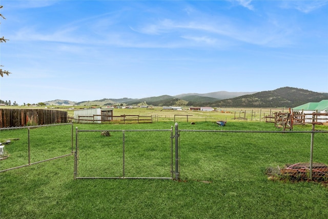 175 Caps Rd, Kalispell, MT 59901 - view of yard featuring a mountain view, a view of countryside, and a gate