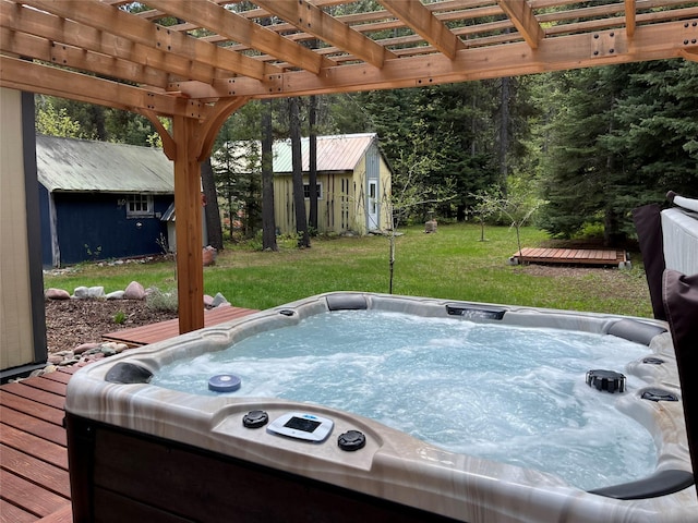 14367 US Highway 2 E, Essex, MT 59916 - view of patio / terrace with a deck, a hot tub, an outdoor structure, and a pergola