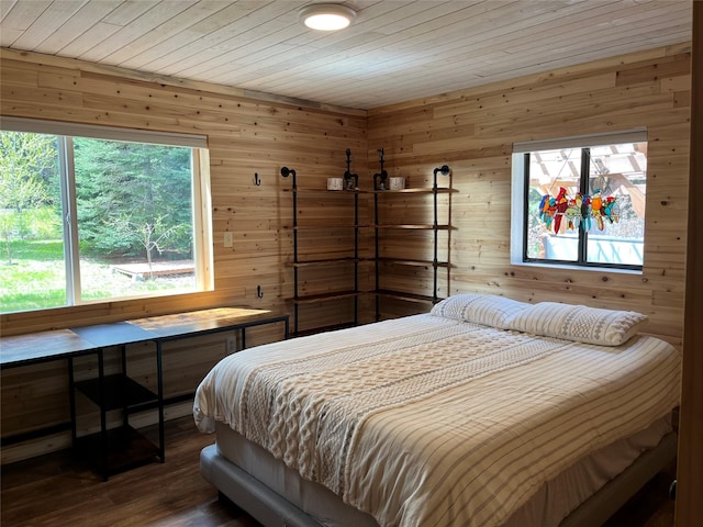 14367 US Highway 2 E, Essex, MT 59916 - bedroom featuring wooden walls, dark wood-style floors, and wooden ceiling