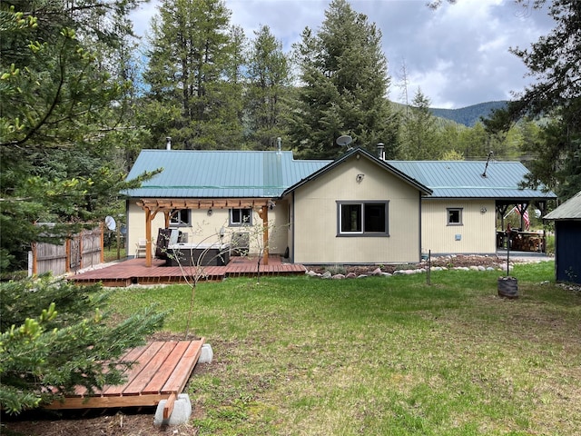 14367 US Highway 2 E, Essex, MT 59916 - back of property featuring metal roof and a deck with mountain view
