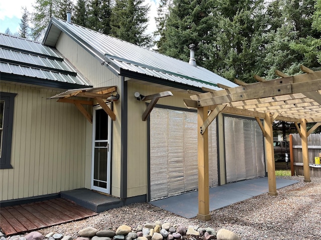 14367 US Highway 2 E, Essex, MT 59916 - view of home's exterior with a pergola and metal roof