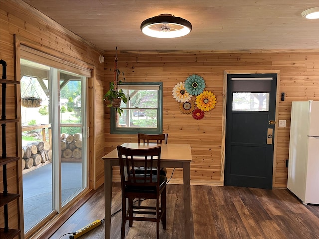 14367 US Highway 2 E, Essex, MT 59916 - dining space with wooden walls, dark wood finished floors, and wooden ceiling