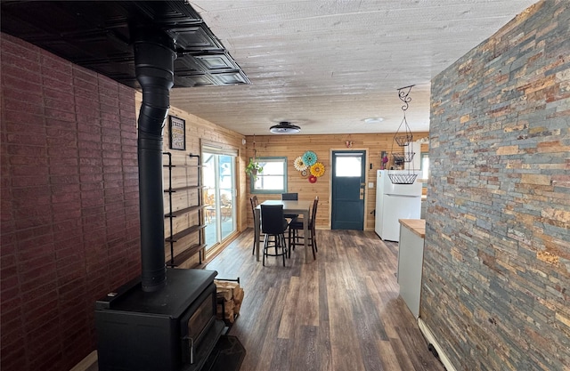 14367 US Highway 2 E, Essex, MT 59916 - dining room with a wood stove and wood finished floors
