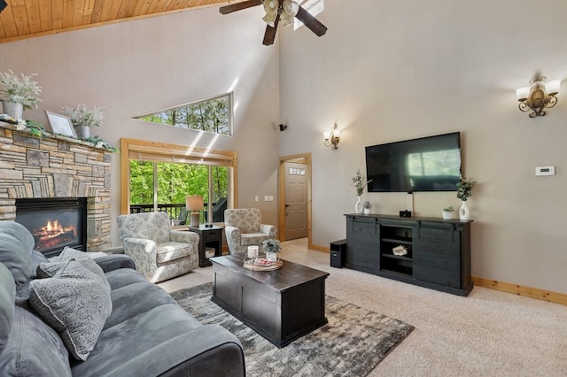 14132 Pine St, Bigfork, MT 59911 - living room featuring wood ceiling, a ceiling fan, carpet, baseboards, and a fireplace