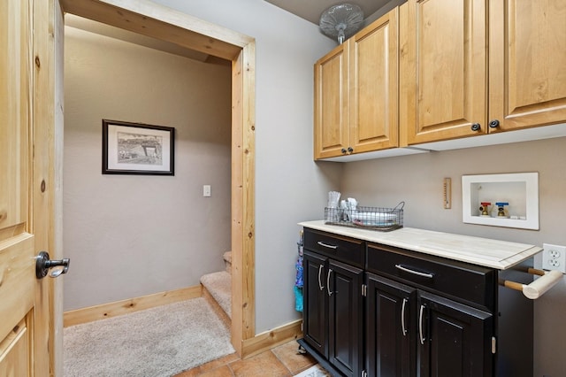 14132 Pine St, Bigfork, MT 59911 - laundry area with cabinet space, washer hookup, and baseboards