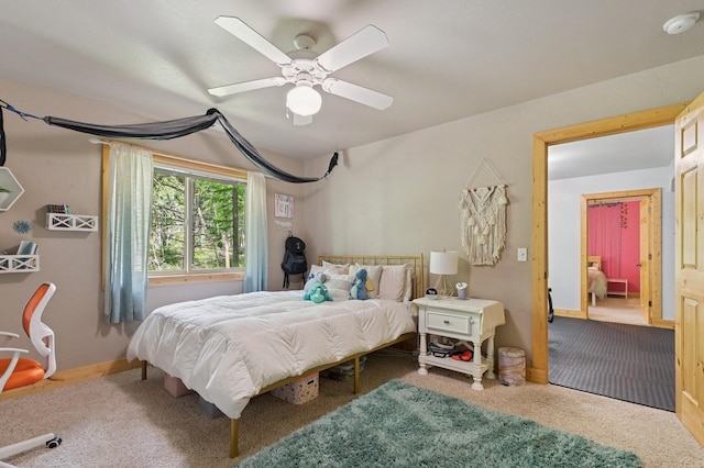 14132 Pine St, Bigfork, MT 59911 - carpeted bedroom featuring ceiling fan and baseboards