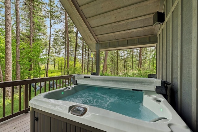 14132 Pine St, Bigfork, MT 59911 - wooden deck featuring a hot tub