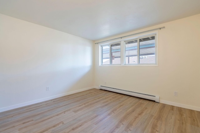 1624 Cannon St Unit 26, Helena, MT 59601 - unfurnished room with baseboard heating, light wood finished floors, and baseboards