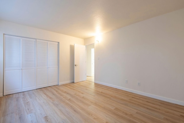 1624 Cannon St Unit 26, Helena, MT 59601 - unfurnished bedroom featuring light wood-type flooring, baseboards, and a closet