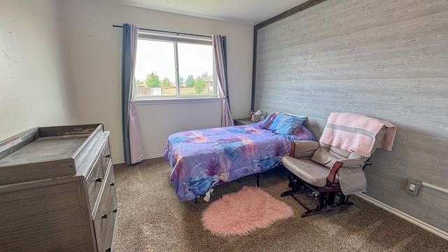 3319 Ivy Dr, Helena, MT 59602 - bedroom featuring wood walls and carpet floors