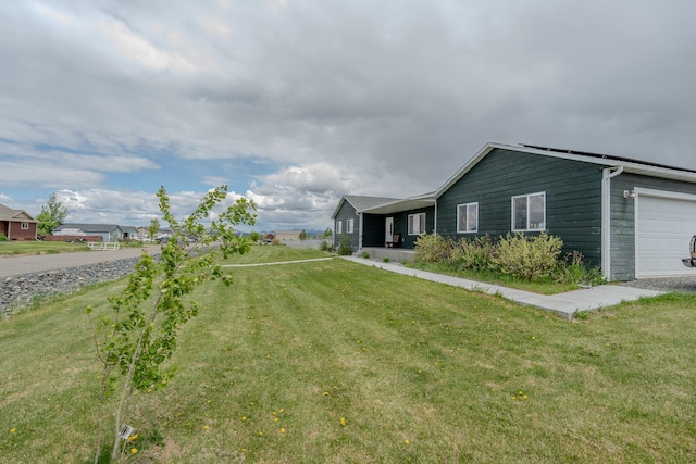 3319 Ivy Dr, Helena, MT 59602 - view of grassy yard with a garage