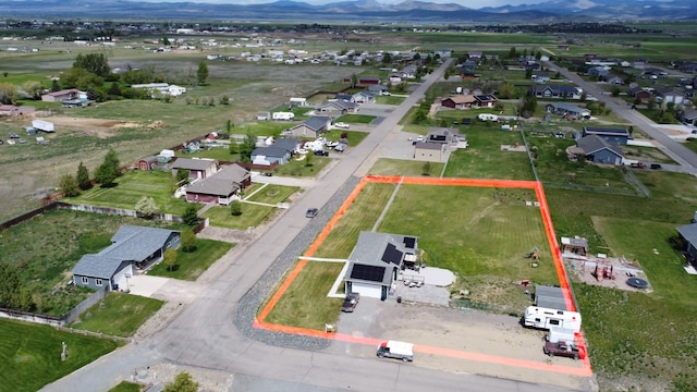 3319 Ivy Dr, Helena, MT 59602 - aerial perspective of suburban area featuring property parcel outlined and mountains