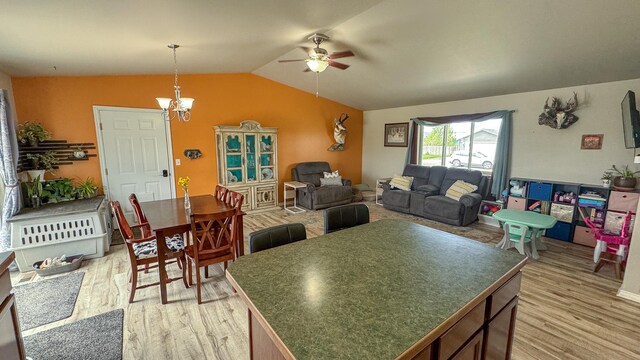 3319 Ivy Dr, Helena, MT 59602 - dining space with ceiling fan, light wood-type flooring, lofted ceiling, and a chandelier