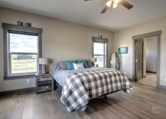 4731 Sea Ray Rd, Helena, MT 59602 - bedroom with light wood finished floors, baseboards, and a ceiling fan