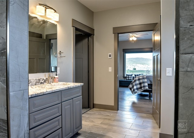 4731 Sea Ray Rd, Helena, MT 59602 - ensuite bathroom with ceiling fan, vanity, and wood finished floors