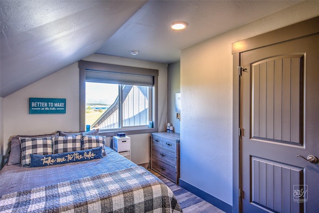 4731 Sea Ray Rd, Helena, MT 59602 - bedroom featuring wood finished floors, lofted ceiling, and baseboards