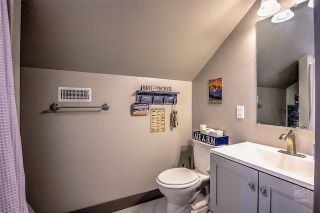 4731 Sea Ray Rd, Helena, MT 59602 - bathroom featuring lofted ceiling, toilet, and vanity