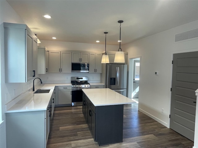 2283 Depot Way, Missoula, MT 59808 - kitchen with appliances with stainless steel finishes, a sink, a kitchen island, light countertops, and recessed lighting