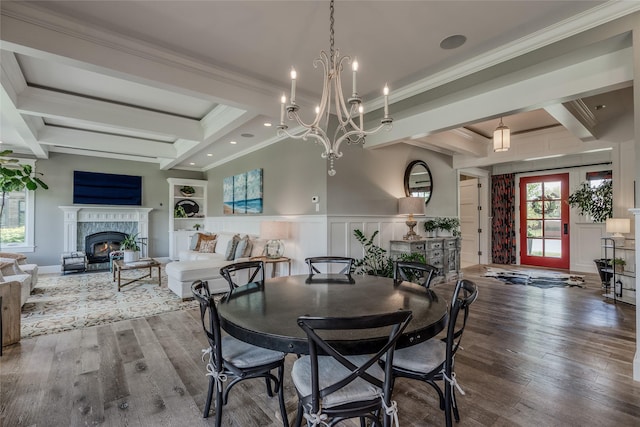 3070 River Lakes Dr, Whitefish, MT 59937 - dining room with wood finished floors, ornamental molding, a chandelier, coffered ceiling, and beamed ceiling