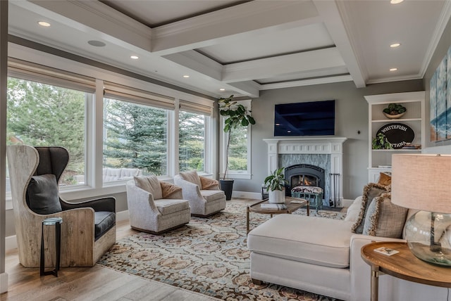 3070 River Lakes Dr, Whitefish, MT 59937 - living room featuring ornamental molding, a fireplace, wood finished floors, baseboards, and coffered ceiling