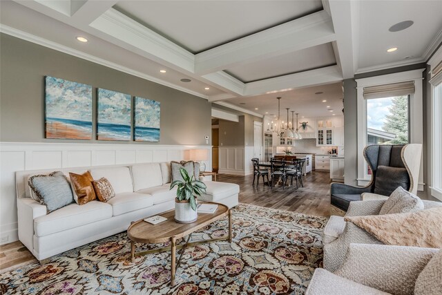 3070 River Lakes Dr, Whitefish, MT 59937 - living area with ornamental molding, a chandelier, wood finished floors, a decorative wall, and recessed lighting