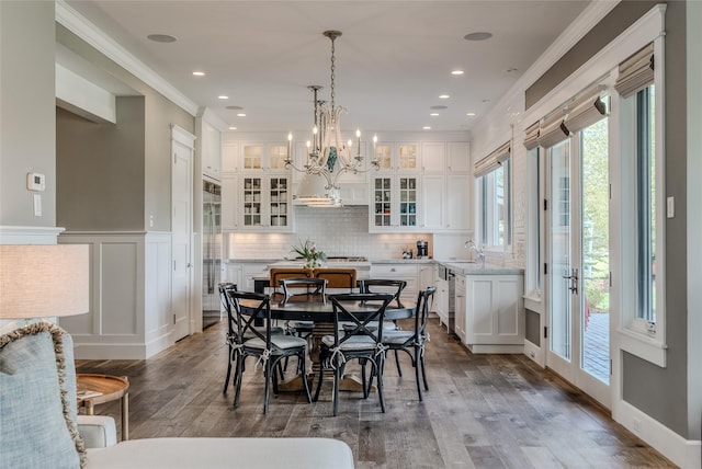 3070 River Lakes Dr, Whitefish, MT 59937 - dining area featuring wood finished floors, crown molding, a chandelier, and recessed lighting