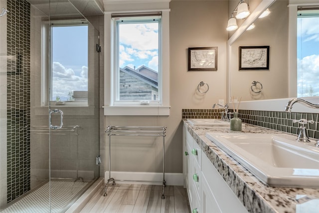 3070 River Lakes Dr, Whitefish, MT 59937 - full bath featuring double vanity, a stall shower, and baseboards