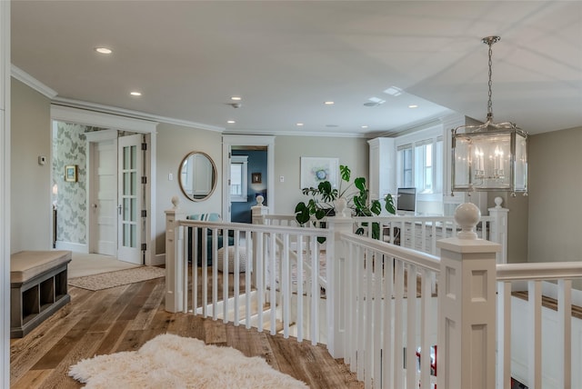 3070 River Lakes Dr, Whitefish, MT 59937 - hall with an upstairs landing, crown molding, wood finished floors, a chandelier, and recessed lighting