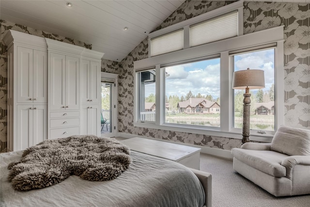 3070 River Lakes Dr, Whitefish, MT 59937 - bedroom with wallpapered walls, lofted ceiling, access to outside, carpet floors, and baseboards