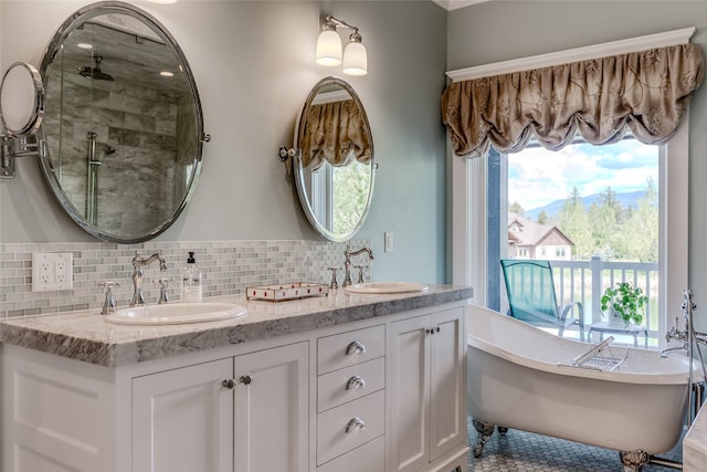 3070 River Lakes Dr, Whitefish, MT 59937 - full bath featuring a freestanding tub, double vanity, tasteful backsplash, and a stall shower