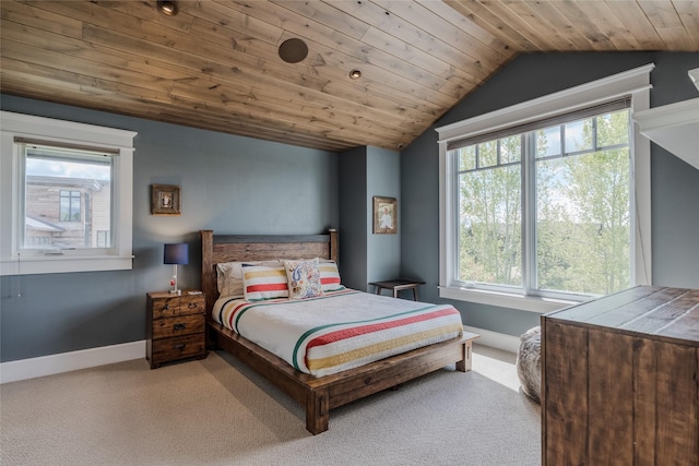 3070 River Lakes Dr, Whitefish, MT 59937 - carpeted bedroom with vaulted ceiling, multiple windows, wood ceiling, and baseboards