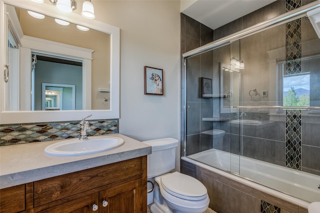 3070 River Lakes Dr, Whitefish, MT 59937 - full bathroom featuring tiled shower / bath, vanity, and toilet